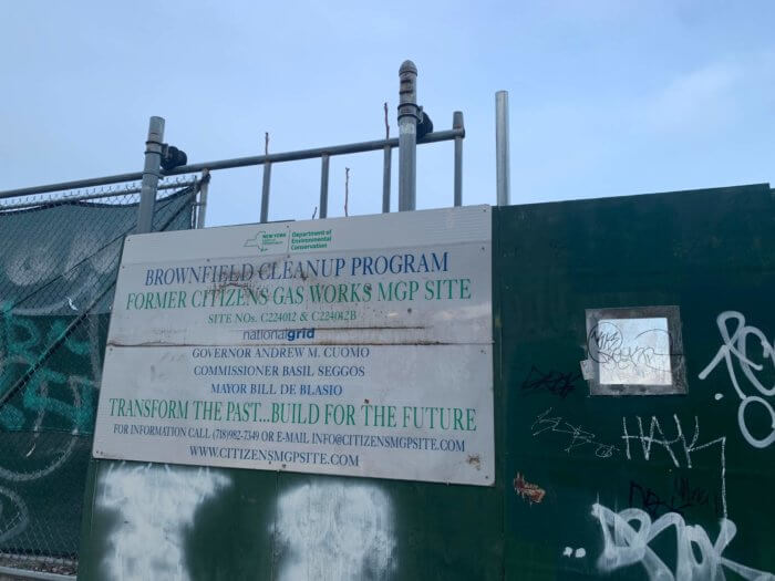 public place in gowanus sign on fence