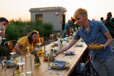 people sitting down at compost dinner at brooklyn grange