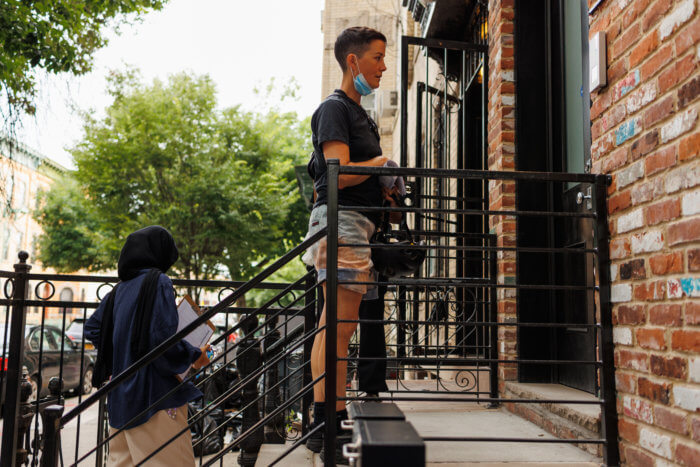 volunteers stnading outside a greenbrook partners building