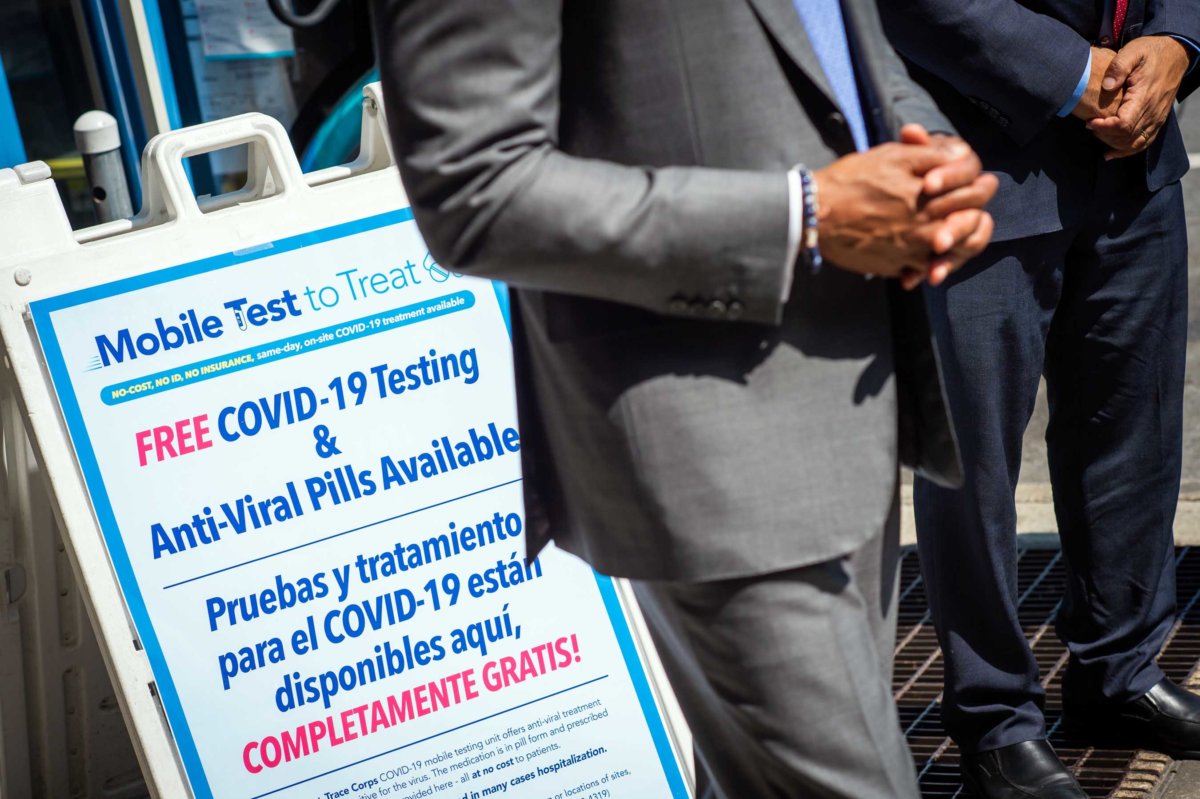 eric adams with sign for mobile covid testing