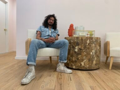 ben wasserman sitting in sparrow funeral home where he performs live after death