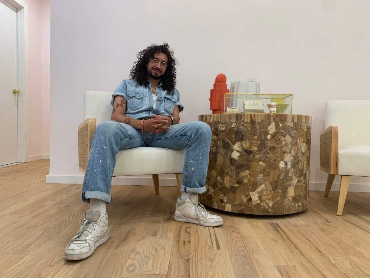 ben wasserman sitting in sparrow funeral home where he performs live after death