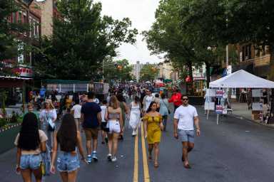 people walking on third avenue during summer stroll in bay ridge