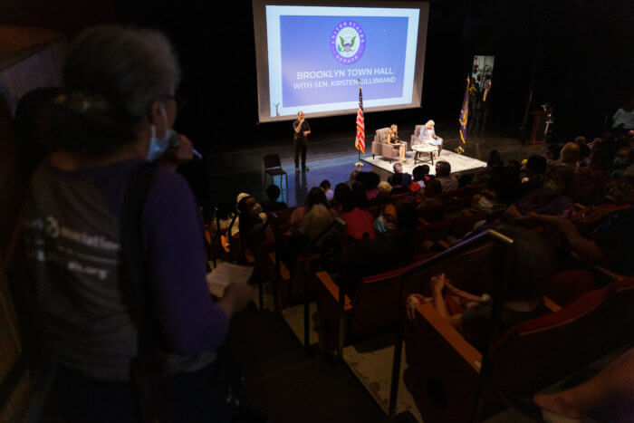 person asks gillibrand question at town hall