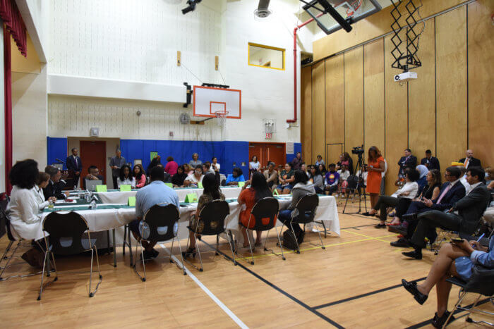 community school panel in school gym