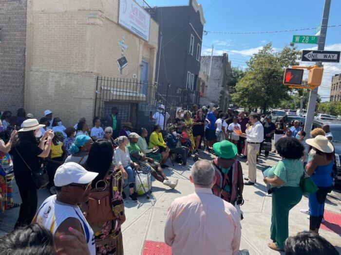 Coney Island crowd gathers at the street renamed after community leader, Charlotte L. Taylor.
