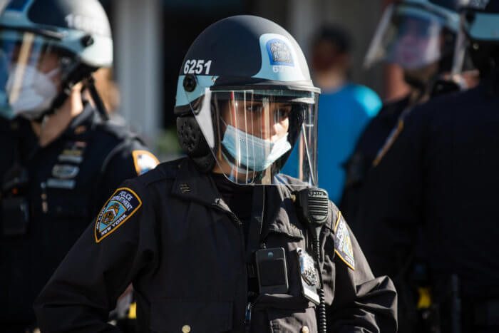 nypd officer at protest. protestors in 2020 detailed cases of police misconduct