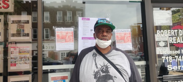 douglas powell outside defalco realty office during housing discrimination protest