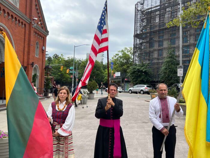 The procession led the crowd with American, Lithuanian and Ukrainian flags.