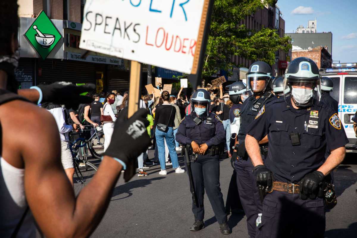 protester and NYPD officer at black lives matter protest police misconduct
