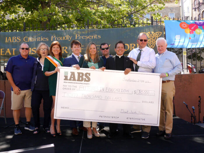 people hold check for futures in education at great irish fair