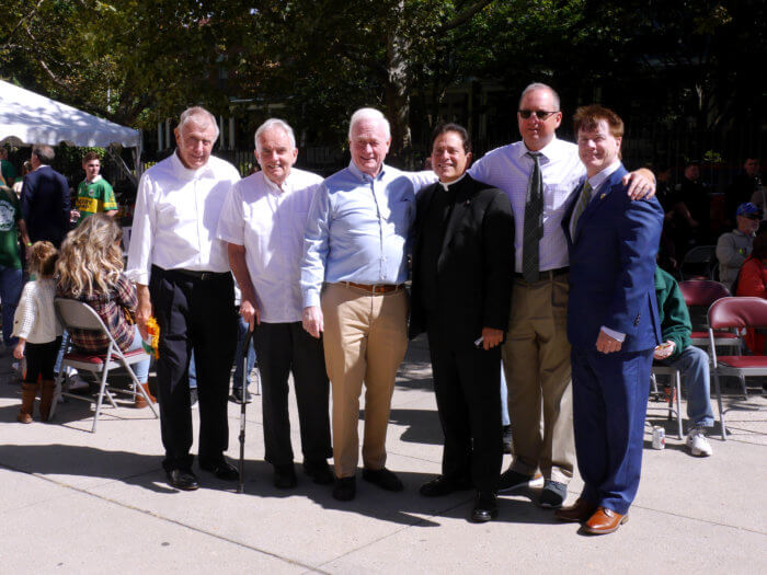men pose for a picture