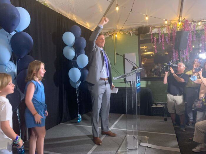dan goldman on stage after primary election win