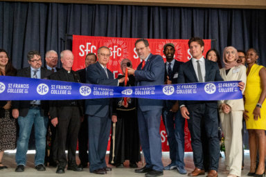 people cut ribbon at st. francis college downtown brooklyn campus