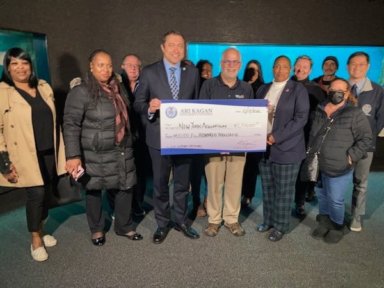 The check donated by Council Member Ari Kagan will go towards capital needs of the NY Aquarium.