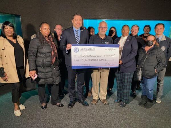 The check donated by Council Member Ari Kagan will go towards capital needs of the NY Aquarium.