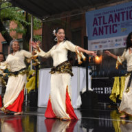 Dancers perform in the rain during the Atlantic Antic festival on Sunday, Oct. 2, 2022.