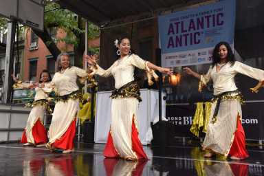Dancers perform in the rain during the Atlantic Antic festival on Sunday, Oct. 2, 2022.