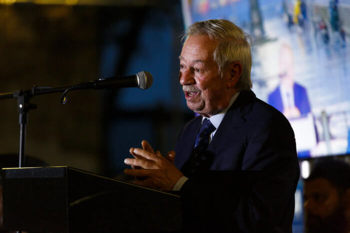 peter abbate speaking at podium