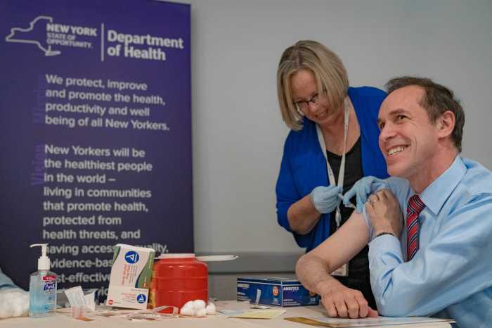 man getting flu shot