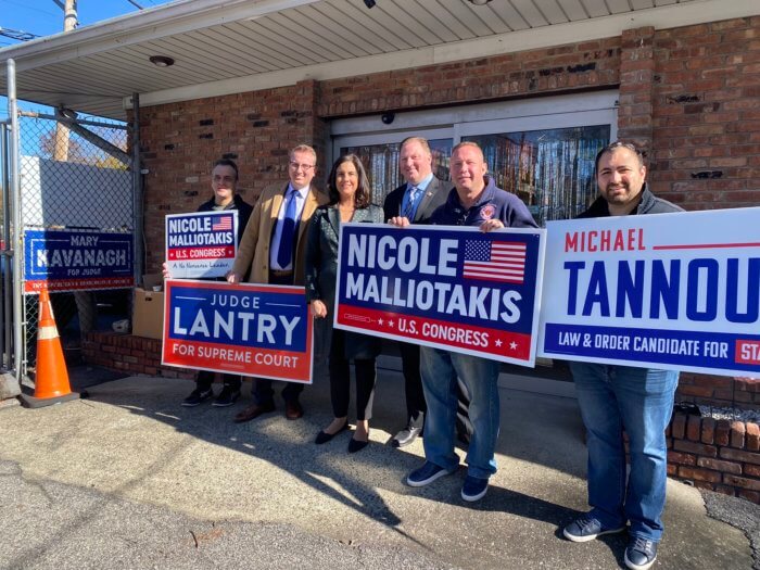 nicole malliotakis with signs ahead of midterm election