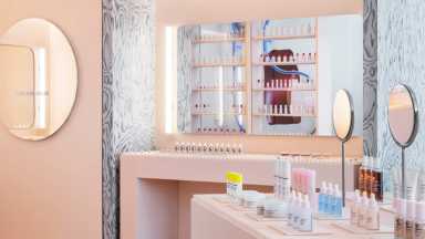 makeup on shelves in williamsburg glossier store