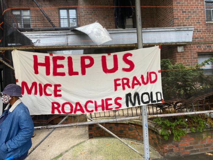 flatbush tenants hung a banner that says their apartments are full of mold, roaches and mice