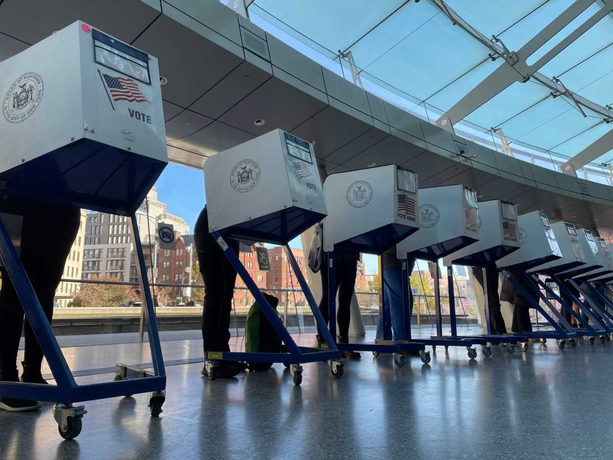 people in voting booths during midterm elections