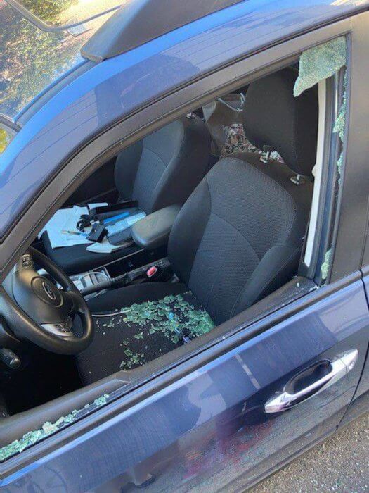 vandalized car near graffiti