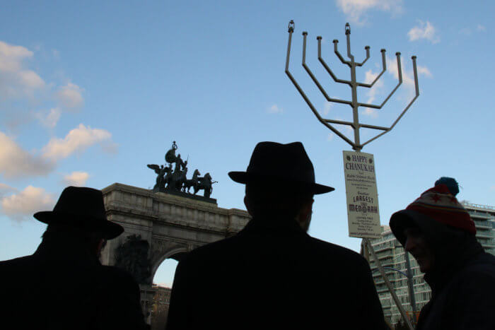 people at menorah lighting in grand army plaza