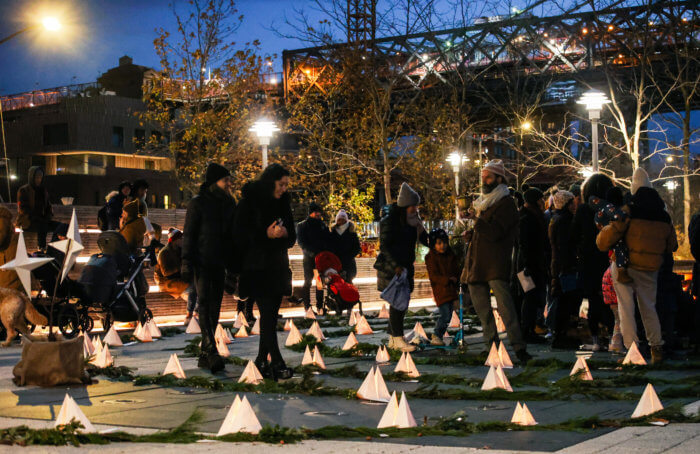 people walk the candlelit spiral at the winter solstice festival