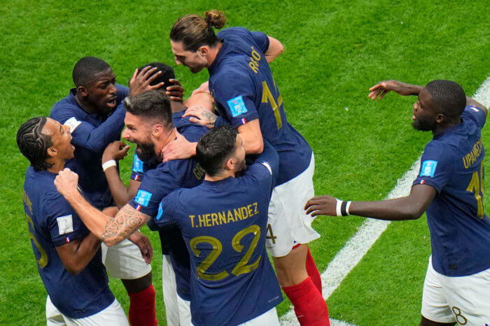 french world cup players celebrating on the field
