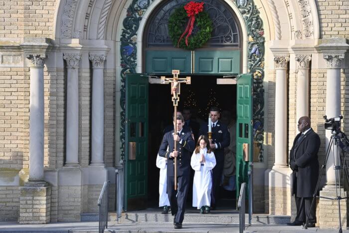 people exiting church after funeral