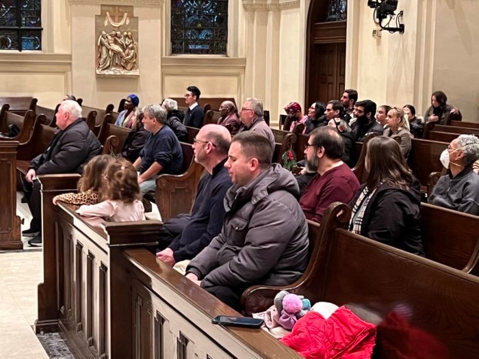 people at prayer service at st. james
