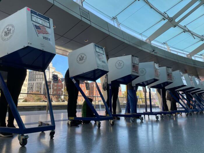 people at voting booths