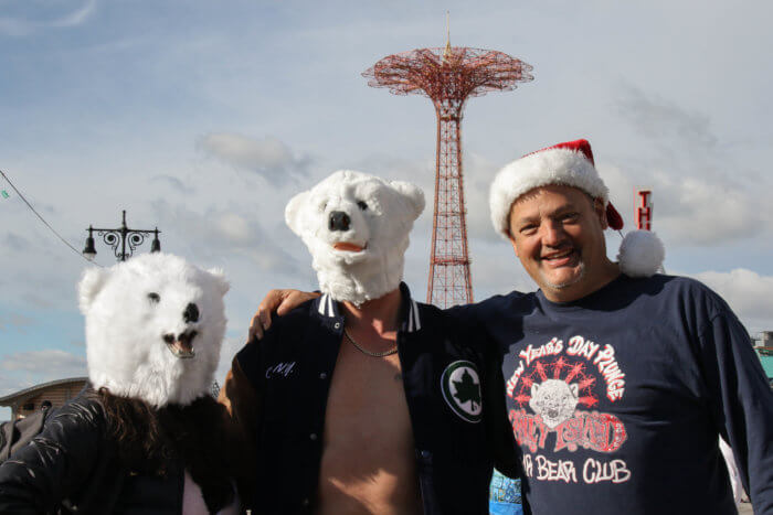 people in polar bear masks at polar plunge