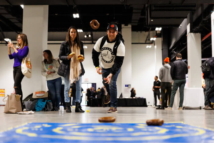 people throwing bagels at bagelfest