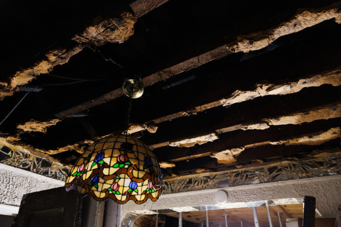 stripped ceiling of apartment after fire