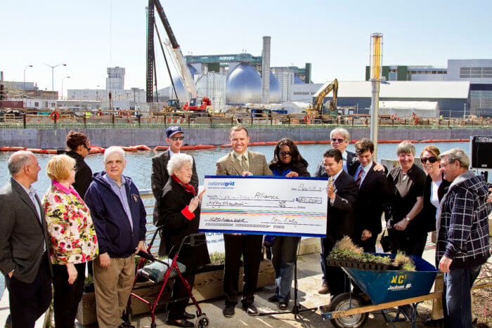 irene with big check at newtown creek