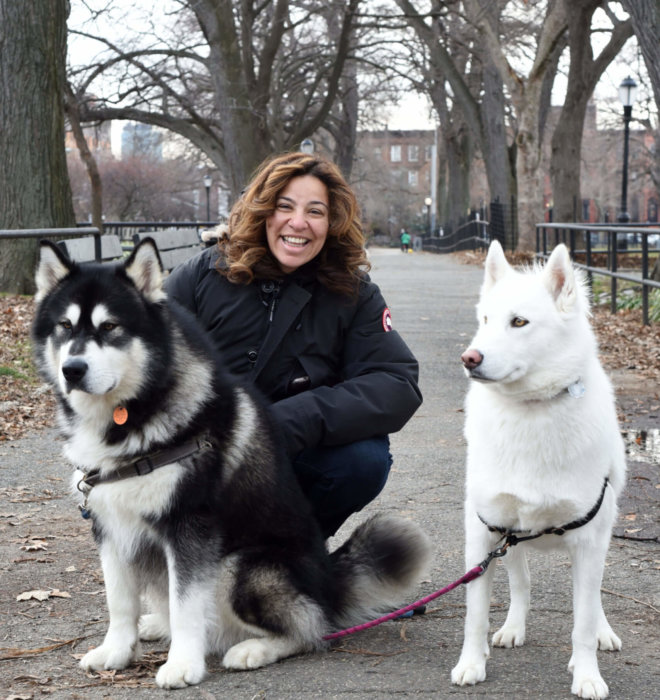 nadia poses with her two dogs
