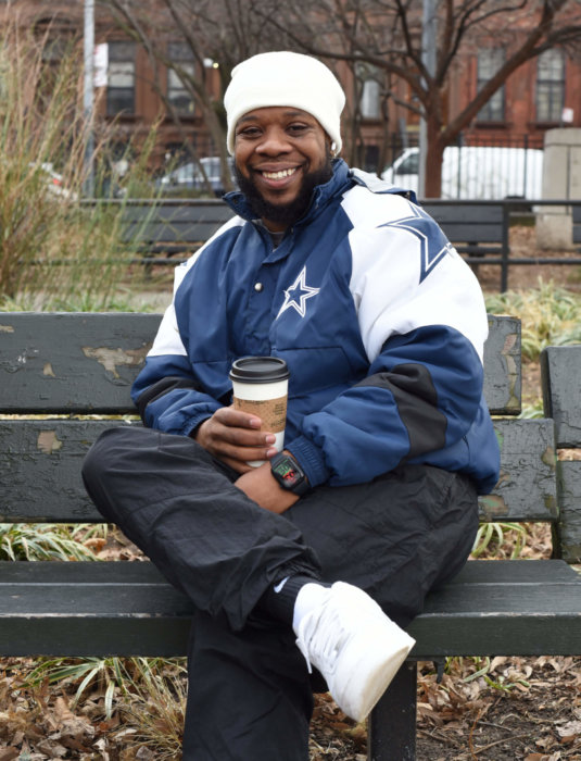 quinn bell on park bench in brooklyn