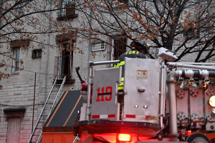 firefighters using ladder at williamsburg fire