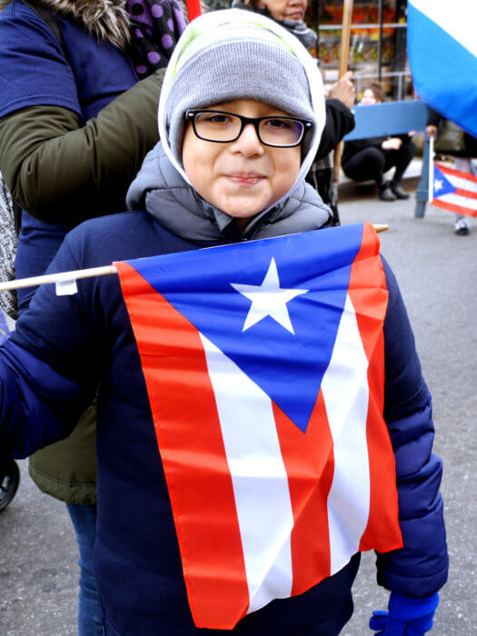 kid with flag at three kings day