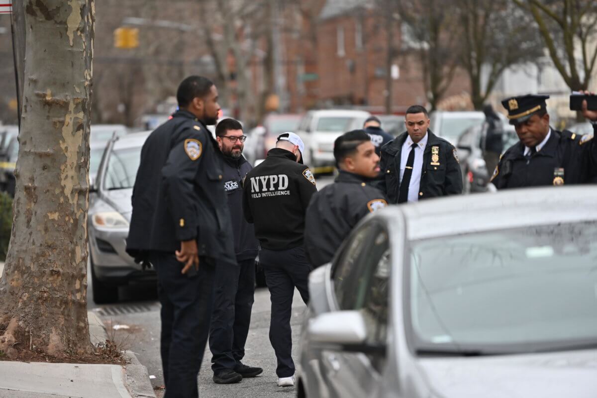 Police investigate the scene of a shooting in Canarsie that left 40-year-old Billy Jean Hippolyte dead.