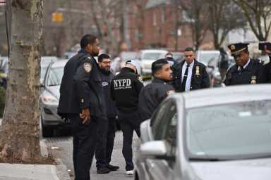 Police investigate the scene of a shooting in Canarsie that left 40-year-old Billy Jean Hippolyte dead.