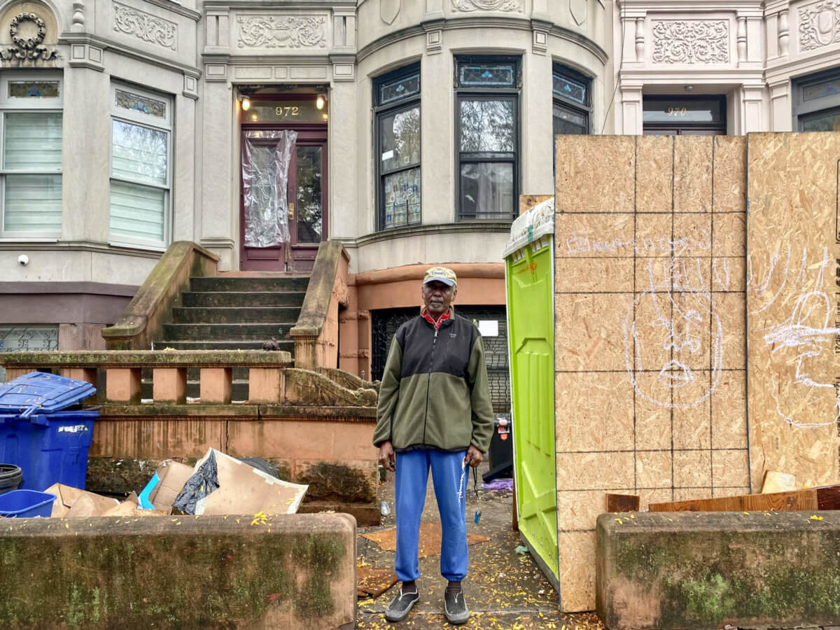 Tenant Francis Roberts in front of 972 Park Place in November, where the landlord is allegedly harassing tenants.