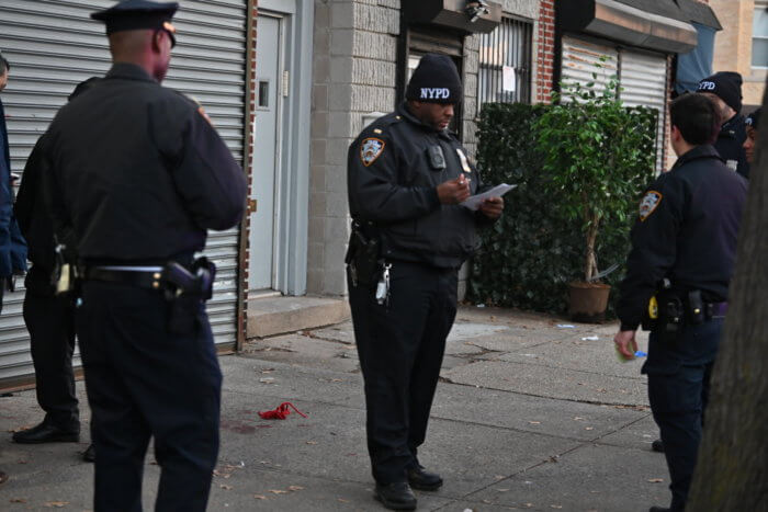 Blood and rope are seen on the ground outside the bloody crime scene. 