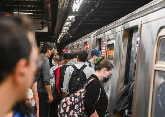 people boarding MTA subway train MTA friends of initiative