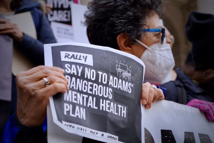 sign at involuntary hospitalization rally