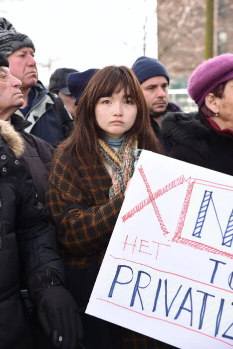 woman holding sign at protest